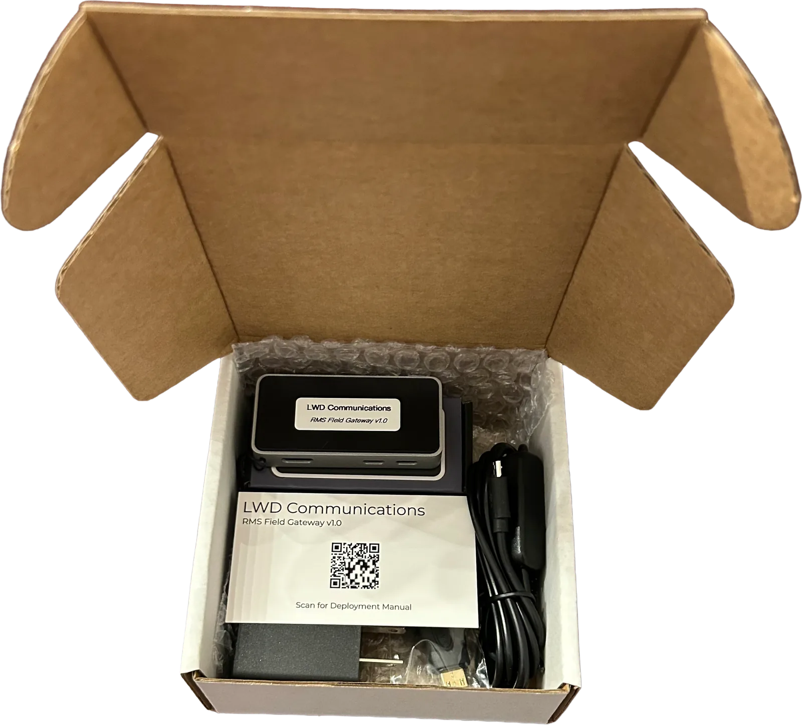 Gateway packed in its box with the manual QR code card
